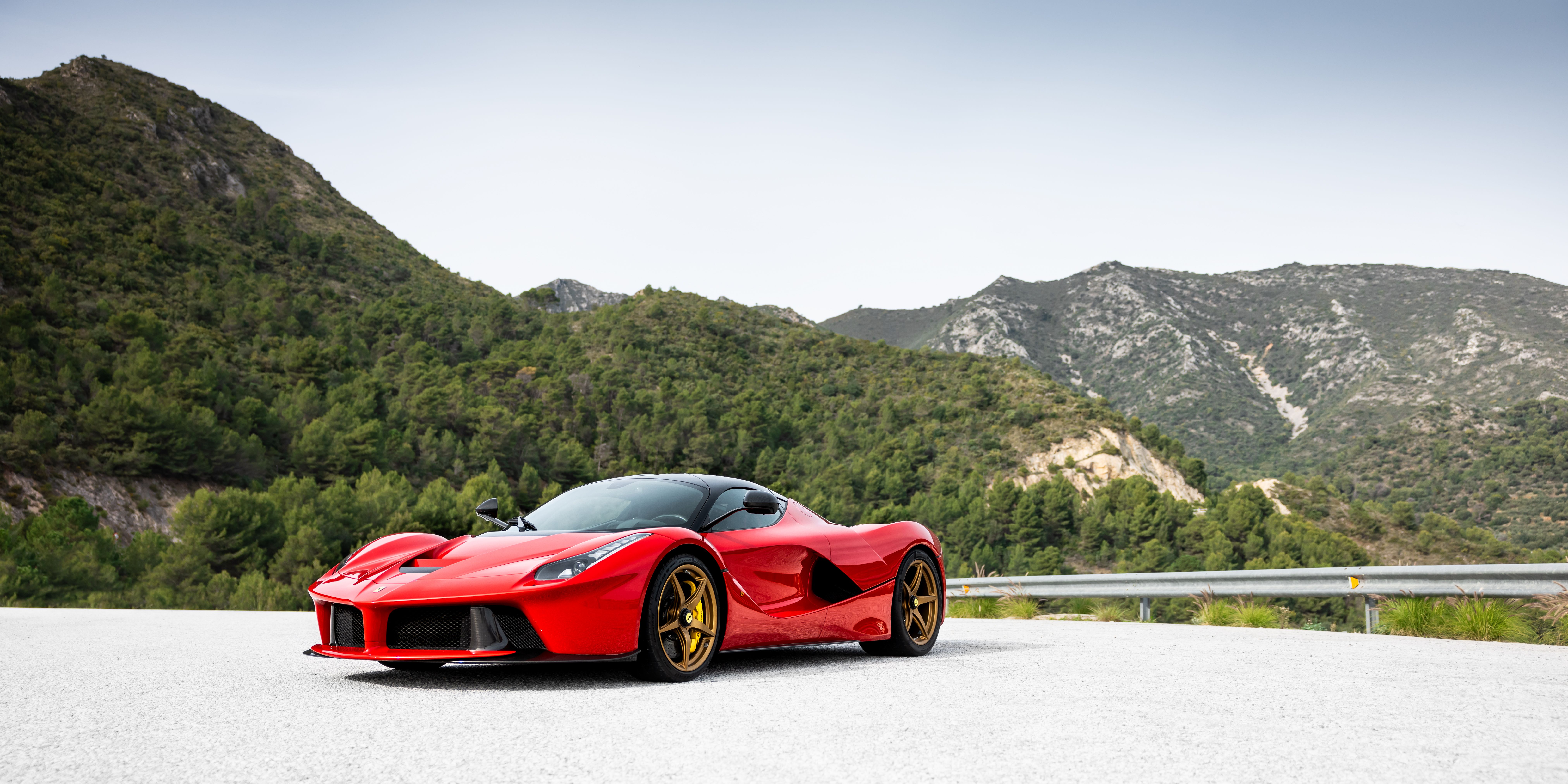 Red Ferrari LaFerrari, front three-quarter in the mountains